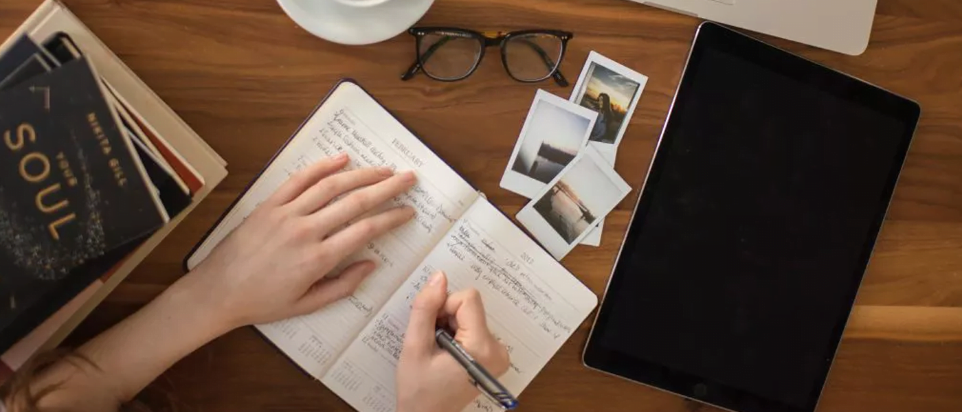 person writing in diary