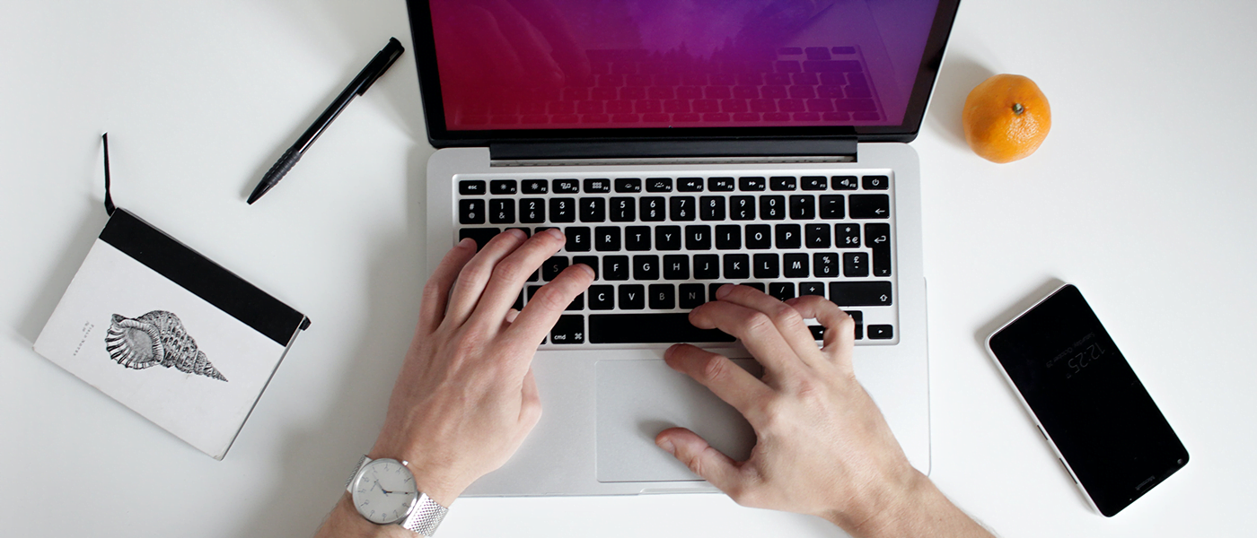 Person typing on laptop