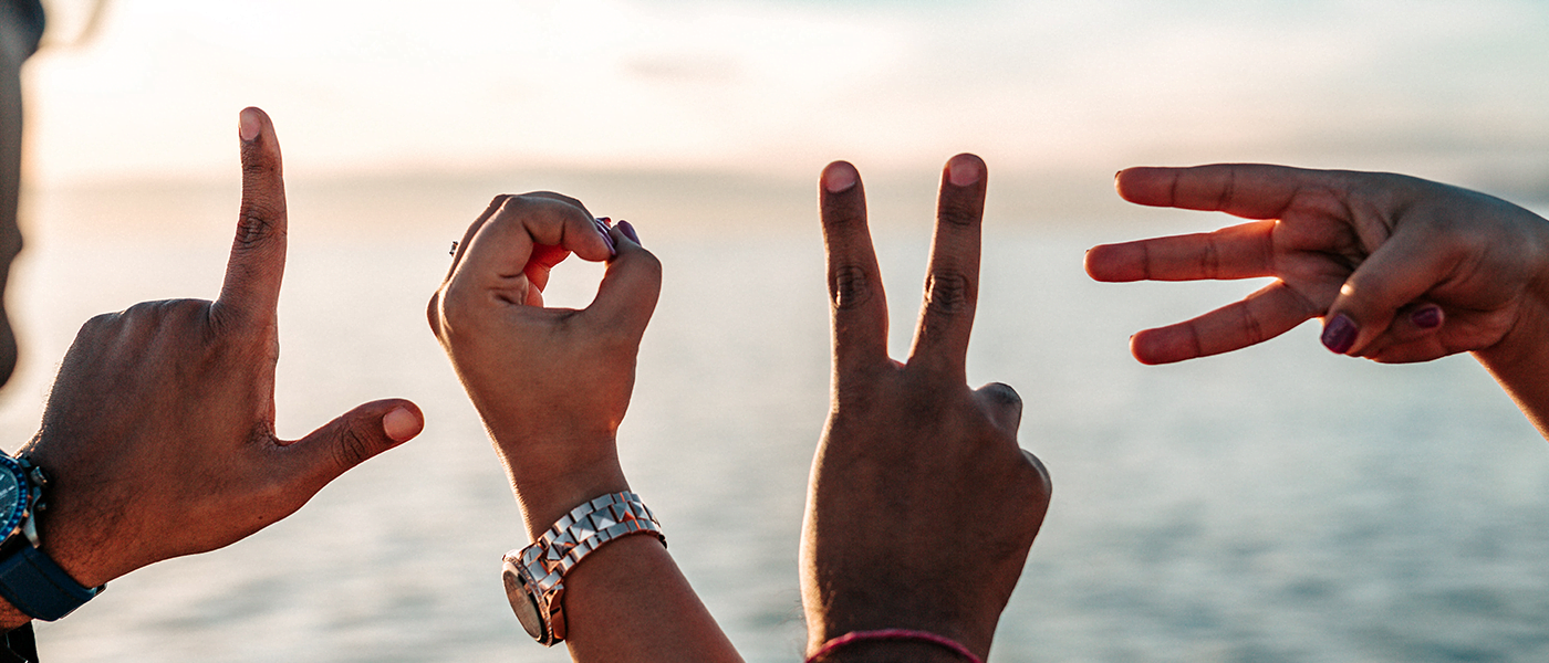 love spelled out by hands