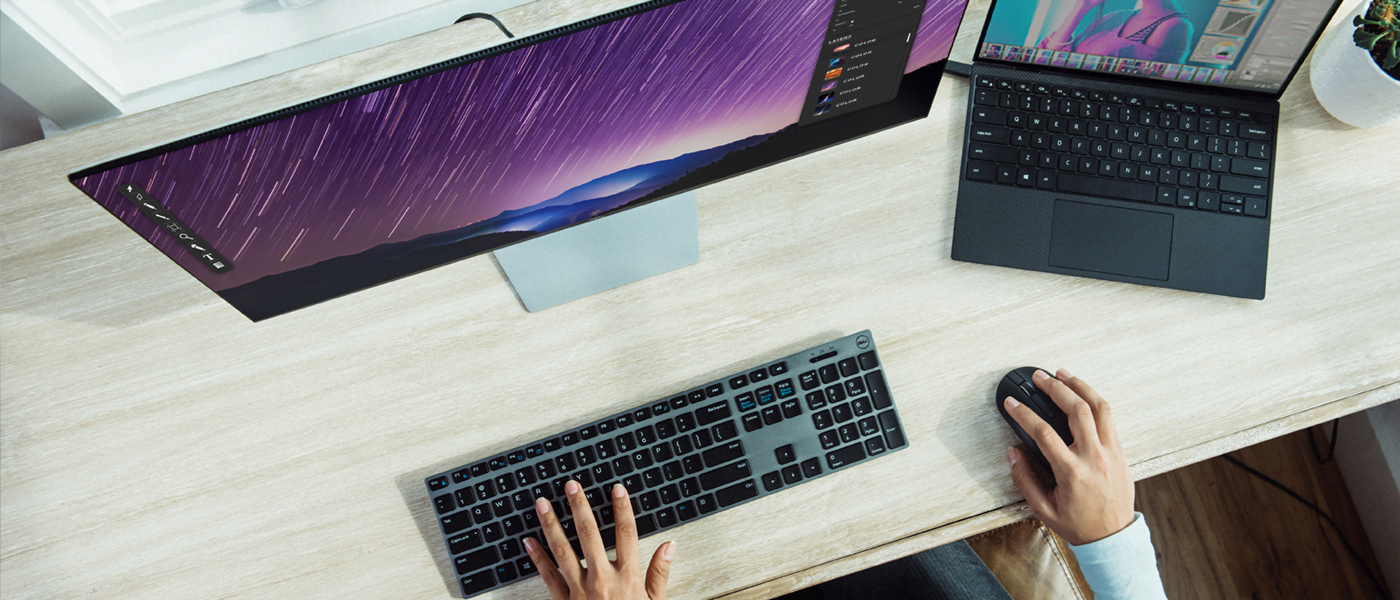 Computer and laptop on desk