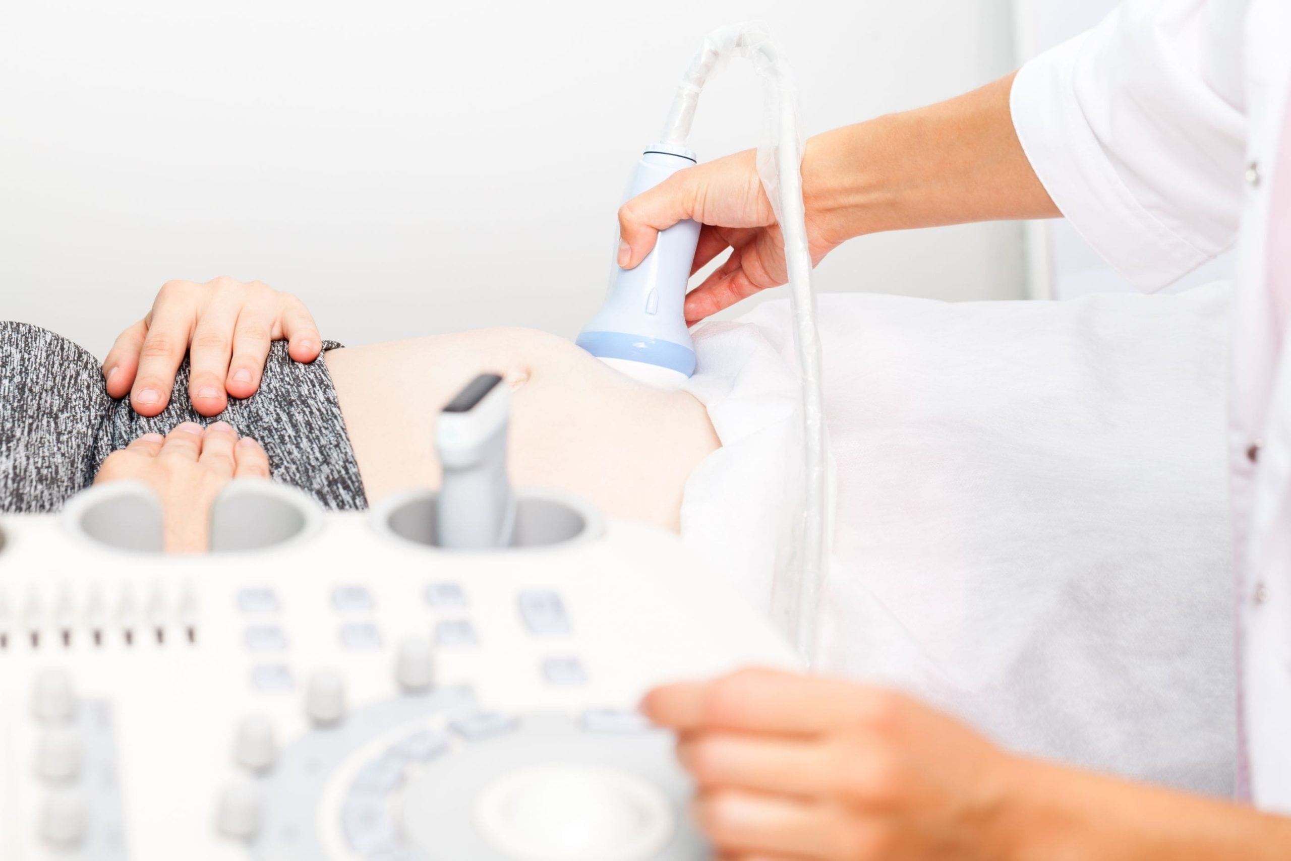 Doctor Performing Obstetric Ultrasound on Pregnant Woman